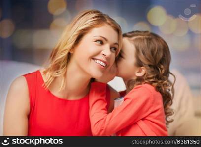 family and people concept - happy mother and daughter whispering something into ear over festive lights background. happy mother and girl whispering into ear