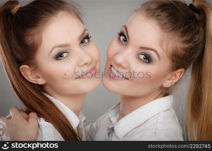 Family and relations. Love and affection concept. Two lovely attractive women playing together. Charming playful sisters have fun smiling.. Lovely playful sisters women portrait.