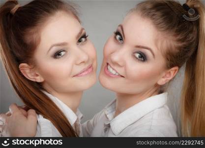 Family and relations. Love and affection concept. Two lovely attractive women playing together. Charming playful sisters have fun smiling.. Lovely playful sisters women portrait.