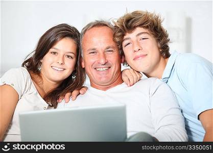 Family at home with laptop computer