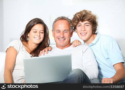 Family at home with laptop computer