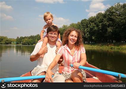 family at the lake in the boat 2