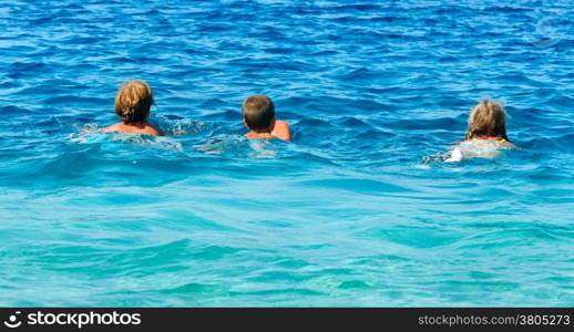 Family bathing in the sea. Summer vacation (Greece, Kefalonia, Beach Antisamos).