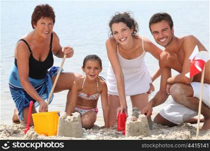 Family building sandcastles