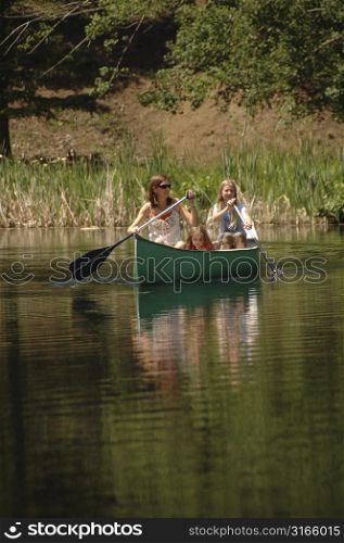Family canoeing on the lake