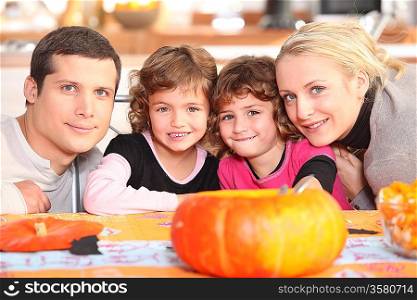 Family carving pumpkins