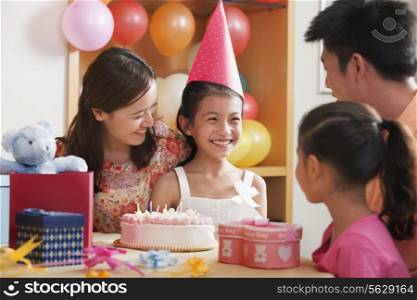 Family Celebrating Girl&rsquo;s Birthday