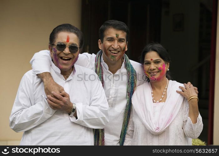 Family celebrating Holi