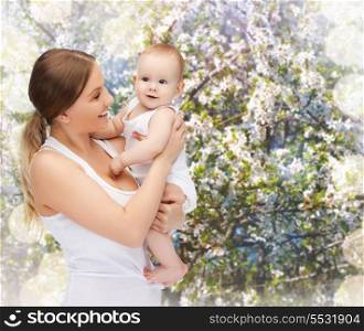 family, child and happiness concept - happy mother with adorable baby