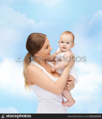 family, child and happiness concept - happy mother with adorable baby