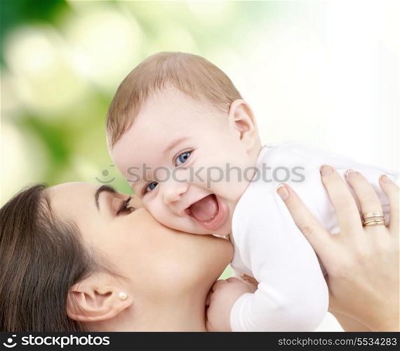 family, child and happiness concept - happy mother with baby