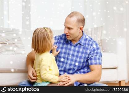 family, child and happiness concept - smiling father and daughter hugging at home