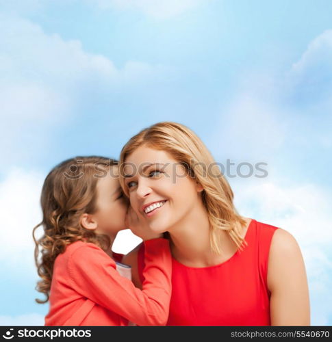 family, child and happiness concept - smiling mother and daughter whispering gossip