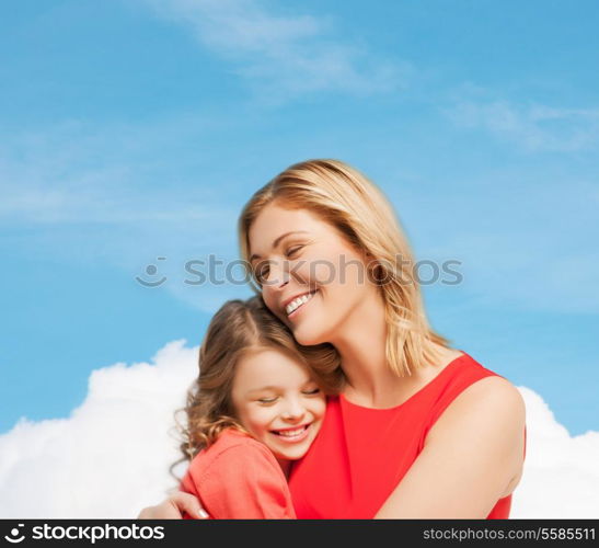 family, child and happiness concpt - hugging mother and daughter