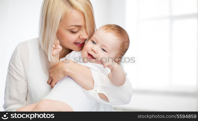 family, child and parenthood concept - happy mother with smiling baby