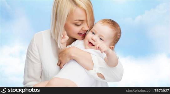 family, child and parenthood concept - happy mother with smiling baby