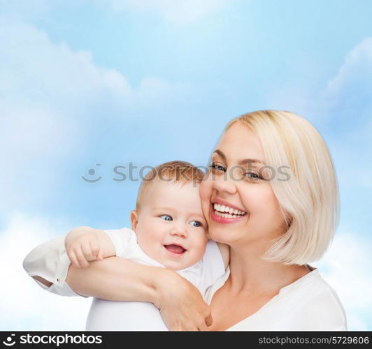 family, child and parenthood concept - happy mother with smiling baby