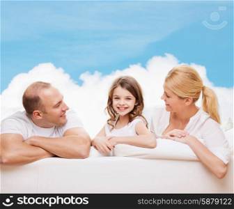 family, childhood and people - smiling mother, father and little girl over blue sky and white cloud background