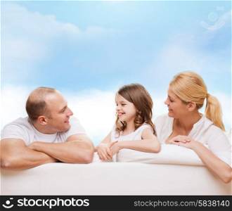 family, childhood and people - smiling mother, father and little girl over blue sky background