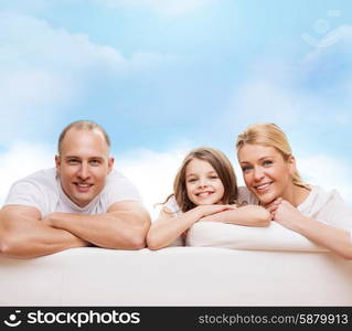 family, childhood and people - smiling mother, father and little girl over blue sky background