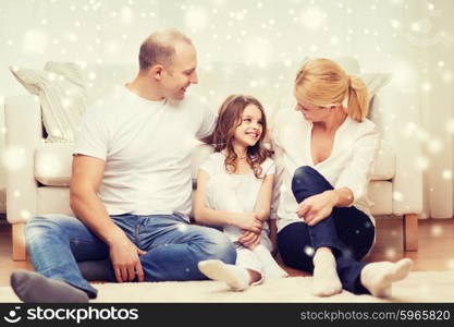 family, childhood, communication, people and home concept - smiling parents with little girl sitting on floor at home