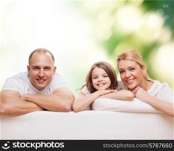 family, childhood, ecology and people - smiling mother, father and little girl over green background