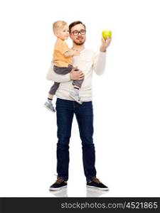 family, childhood, fatherhood, healthy eating and people concept - happy father and and little son with green apple