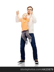 family, childhood, fatherhood, leisure and people concept - happy father and little son playing and having fun