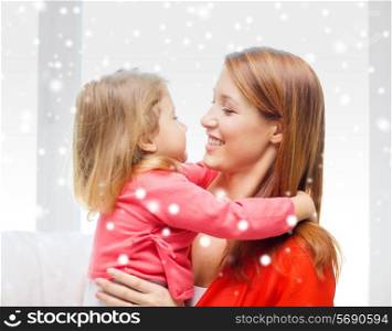 family, childhood, holidays and people concept - happy mother and daughter kissing at home