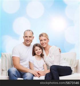 family, childhood, holidays and people concept - smiling mother, father and little girl over blue lights background