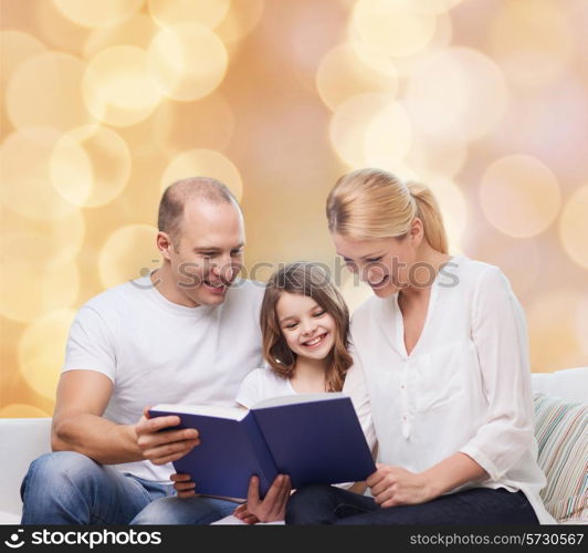 family, childhood, holidays and people - smiling mother, father and little girl reading book over beige lights background