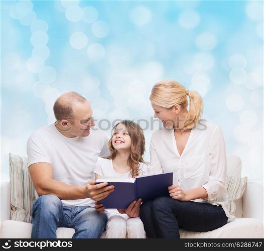 family, childhood, holidays and people - smiling mother, father and little girl reading book over blue lights background