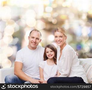 family, childhood, holidays and people - smiling mother, father and little girl over lights background