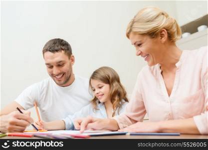 family, children and happy people concept - happy family drawing at home