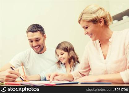 family, children and happy people concept - happy family drawing at home