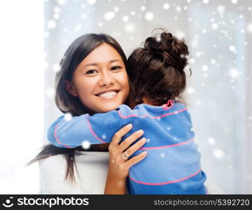 family, children and happy people concept - hugging mother and daughter