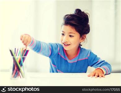 family, children and happy people concept - little girl drawing
