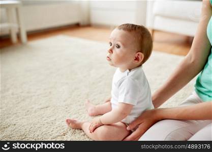 family, children and parenthood concept - little baby with mother at home