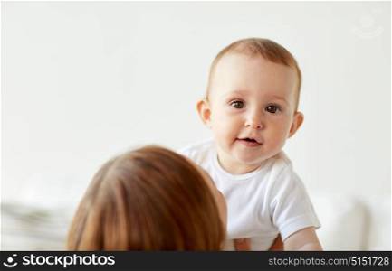 family, children and people concept - happy little baby with mother at home. happy little baby with mother at home