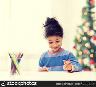 family, children, christmas, x-mas and happy people concept - little girl drawing