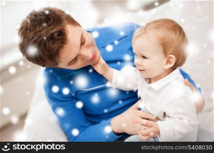 family, children, christmas, x-mas, love concept - happy father with adorable baby
