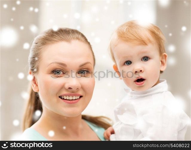 family, children, christmas, x-mas, love concept - happy mother with adorable baby