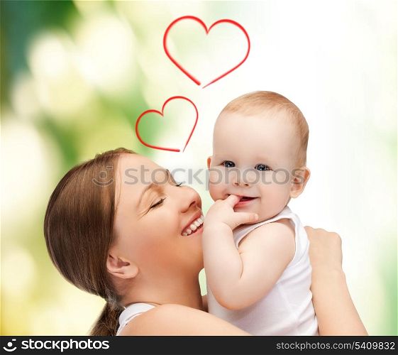 family, children, parenthood and happiness concept - happy mother with adorable baby