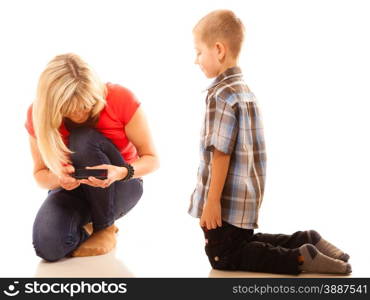 Family, children, parenthood, technology and internet concept. Mother and son playing video game on smartphone isolated on white