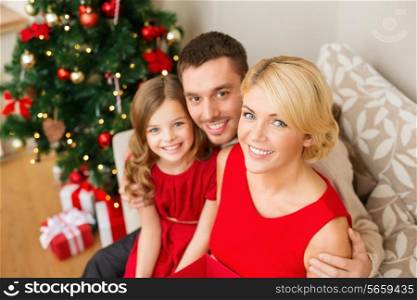 family, christmas, x-mas, happiness and people concept - happy family at home