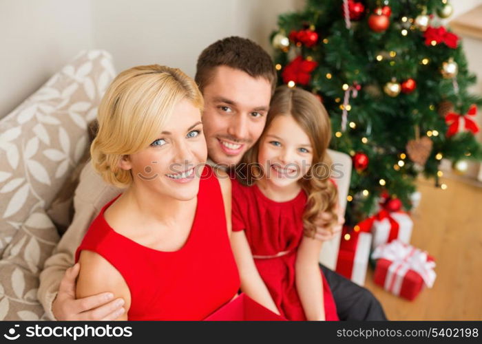 family, christmas, x-mas, winter, happiness and people concept - happy family at home