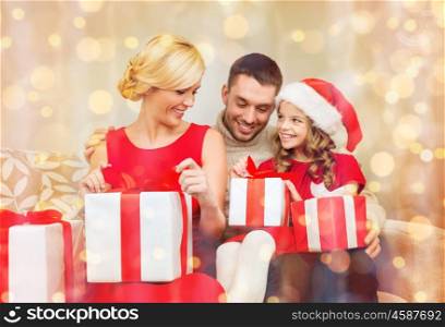 family, christmas, x-mas, winter, happiness and people concept - happy family opening