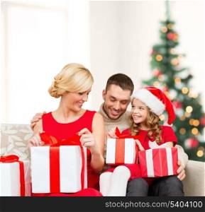 family, christmas, x-mas, winter, happiness and people concept - happy family opening