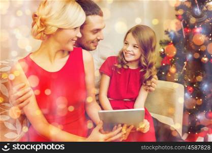 family, christmas, x-mas, winter, happiness, technology and people concept - smiling family with tablet pc