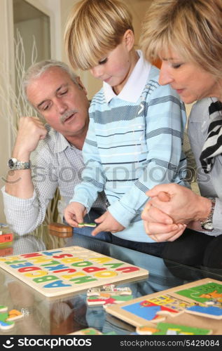 Family completing a puzzle together